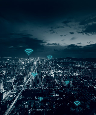 picture of a city with cyber icons above buildings